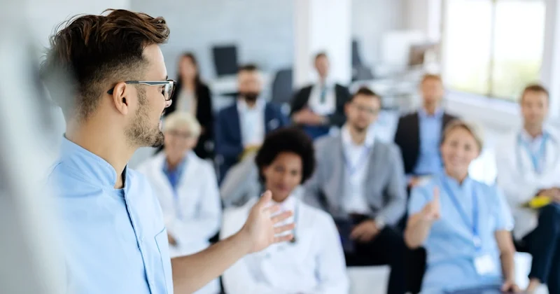 Image of a meeting about injury prevention and training in a safe work environment to reduce the risk of work-related injuries among personal service workers.